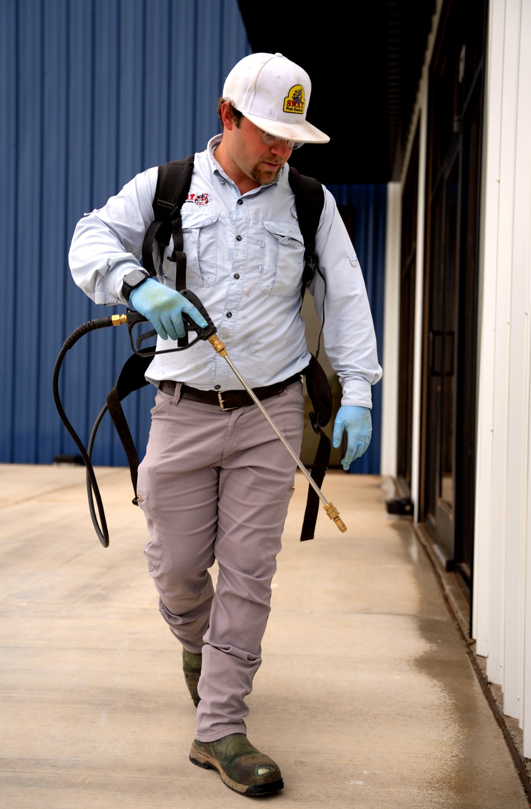 SWAT Pest Control technician performing professional pest inspection