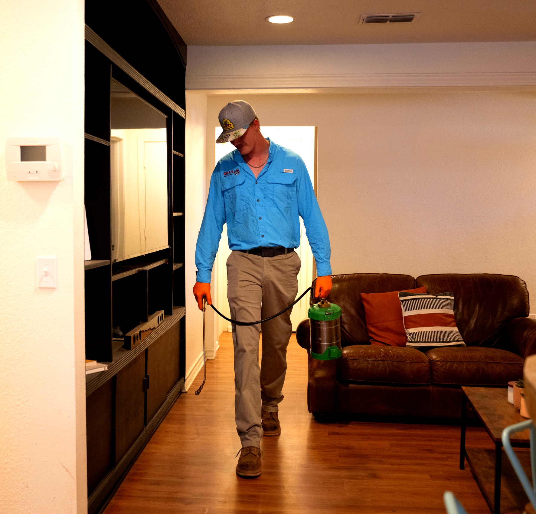SWAT technician performing interior residential pest treatment